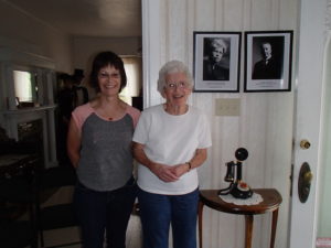 Mary Jane and me at the Parkison House.  The pictures on the wall are of Ed and Ella Parkison, her grandparents. 