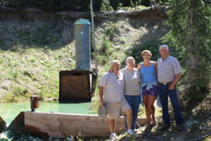 Descendant of Robert deal in front of the mine entrance.